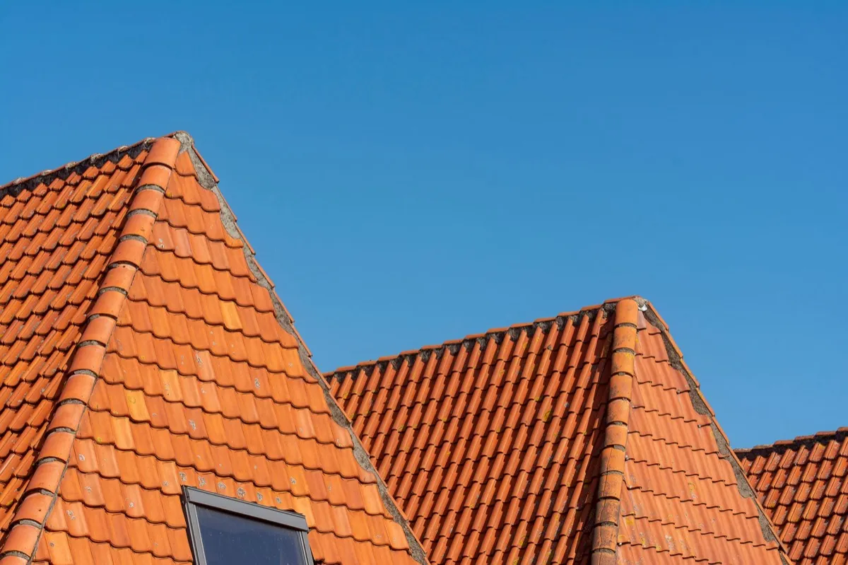 Clay barrel tile rooflines on homes in Saginaw, MI