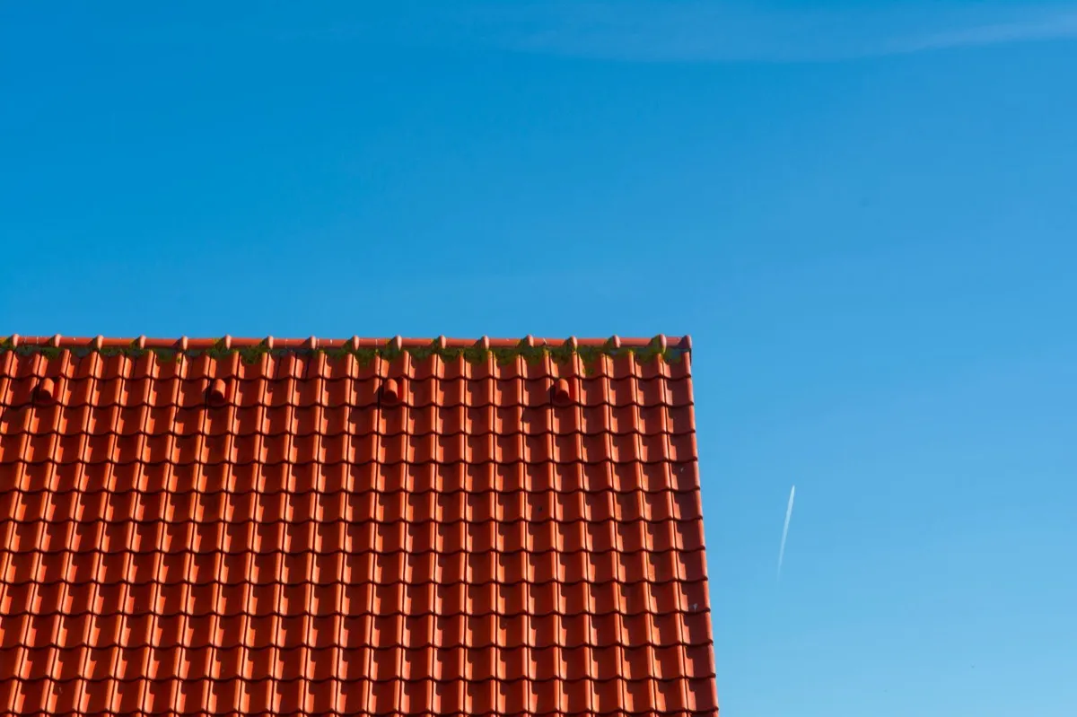 Tile roof gable in full sun, the kind of exposure that sets roof life in Saginaw, MI